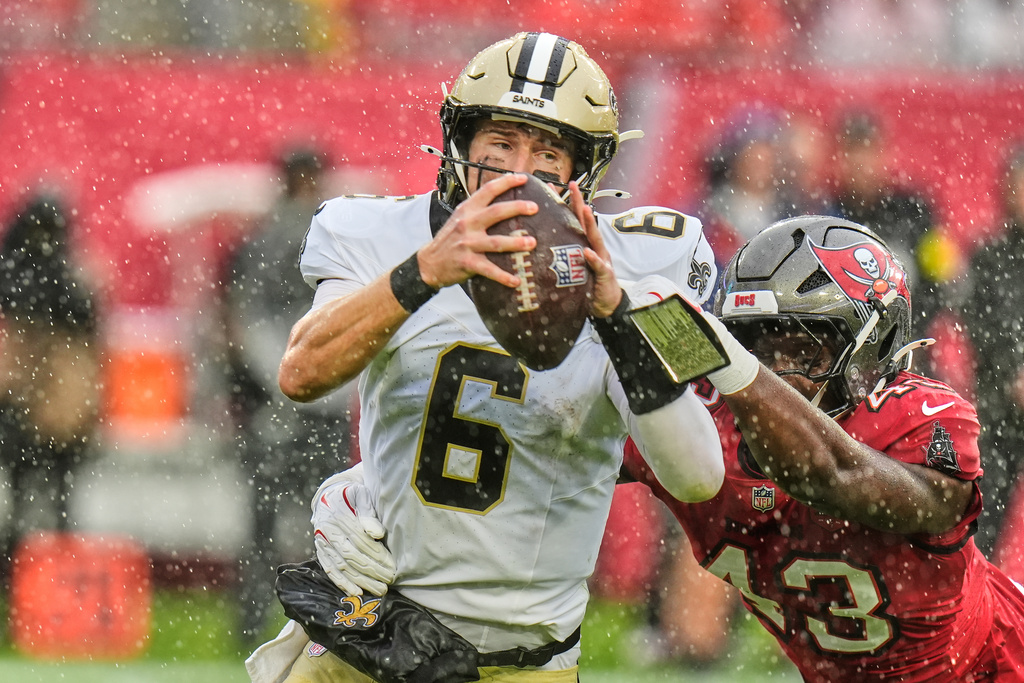 New Orleans Saints quarterback Tyler Shough (6) is sacked by Tampa Bay Buccaneers linebacker Chris Braswell (43) in the first half of an NFL football game, Sunday, Dec. 7, 2025, in Tampa, Fla. (AP Photo/Chris O'Meara)