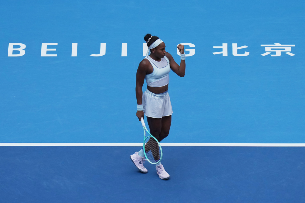 Coco Gauff, of the United States reacts after scoring a point against Eva Lys, of Germany during the women's singles quarterfinals match of the China Open tennis tournament, at the National Tennis Center, in Beijing, Thursday, Oct. 2, 2025. (AP Photo/Andy Wong)