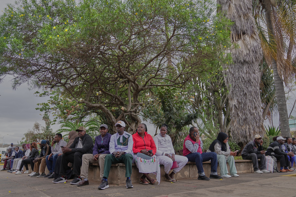 Passengers wait for their delayed flights during a workers strike at Jomo Kenyatta International Airport in Nairobi, Kenya, Monday, Aug. 31, 2026. (AP Photo/Brian Inganga)