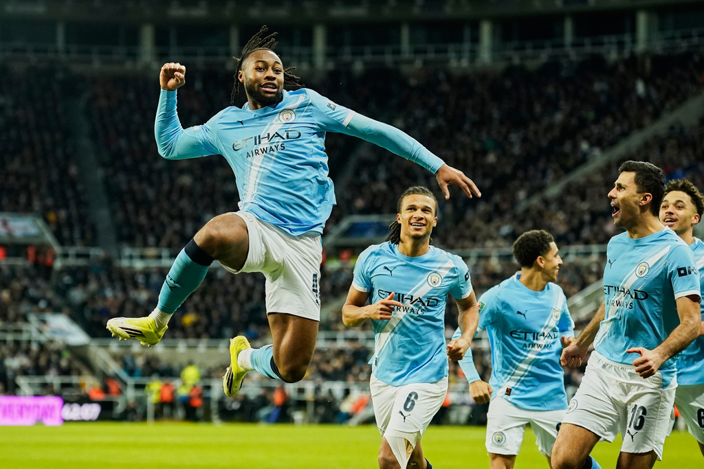 Manchester City's Antoine Semenyo, left, celebrates a goal that was later disallowed by a VAR decision during the English League Cup semifinal first leg soccer match between Newcastle and Manchester City in Newcastle, England, Tuesday, Jan. 13, 2026. (AP Photo/Dave Thompson)