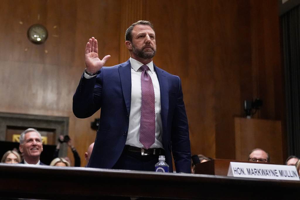 Sen. Markwayne Mullin, R-Okla., President Donald Trump's pick for Homeland Security secretary, is sworn in before testifying during Senate Committee on Homeland Security and Governmental Affairs hearing, Wednesday, March 18, 2026 on Capitol Hill in Washington. (AP Photo/Manuel Balce Ceneta)