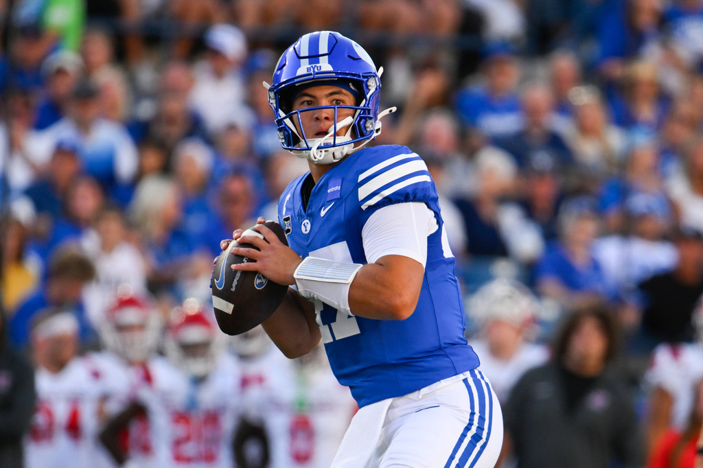 BYU quarterback Bear Bachmeier looks for a pass in the first half of an NCAA college football game against Utah Tech Saturday, Sept. 5, 2026 in Provo, Utah. (AP Photo/Alex Goodlett)