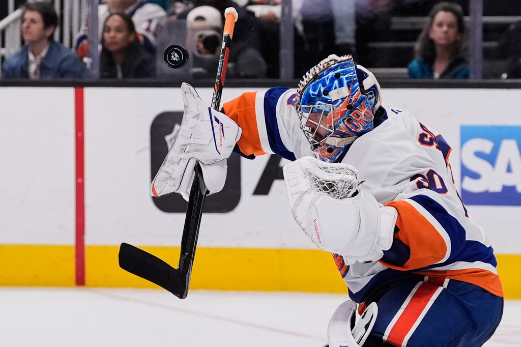 New York Islanders goaltender Ilya Sorokin (30) deflects a shot during the third period of an NHL hockey game against the San Jose Sharks, Saturday, March 7, 2026, in San Jose, Calif. (AP Photo/Godofredo A. Vásquez)