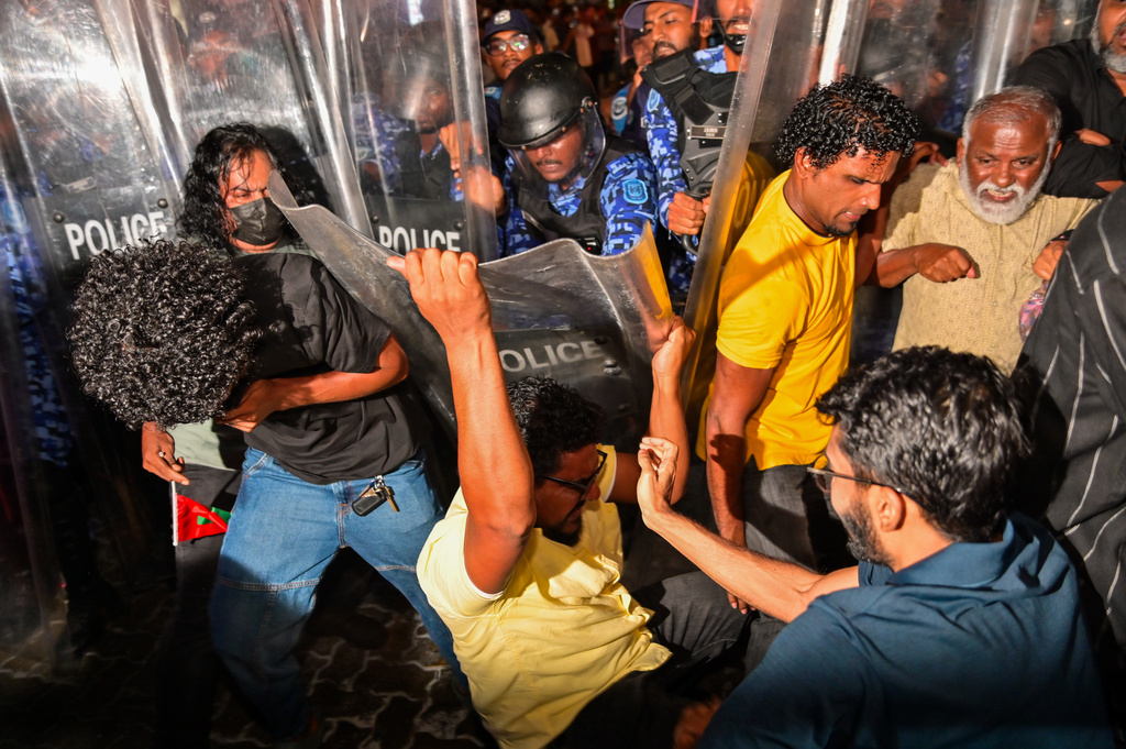 Opposition supporters clash with police during an anti-government protest in Male, Maldives, Friday, Oct, 3, 2025. (AP Photo/ Mohamed Sharhaan)