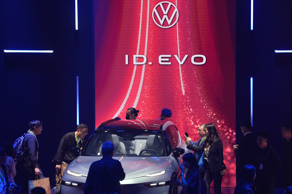 Attendees look at the ID.EVO concept car during the Volkswagen Group media night ahead of the Auto Show in Shanghai, April 22, 2025. (AP Photo/Ng Han Guan)