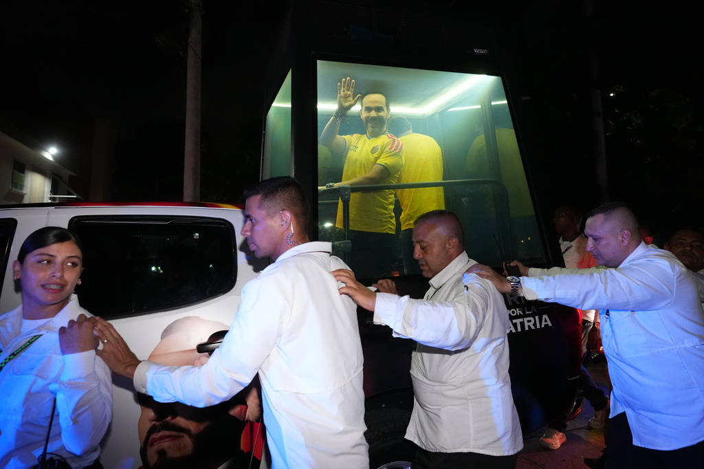Presidential candidate Abelardo de la Espriella of the opposition Defenders of the Motherland movement rides in a bulletproof booth toward a celebration rally after election results showed him leading in Barranquilla, Colombia, Sunday, June 21, 2026. (AP Photo/Rodrigo Abd)