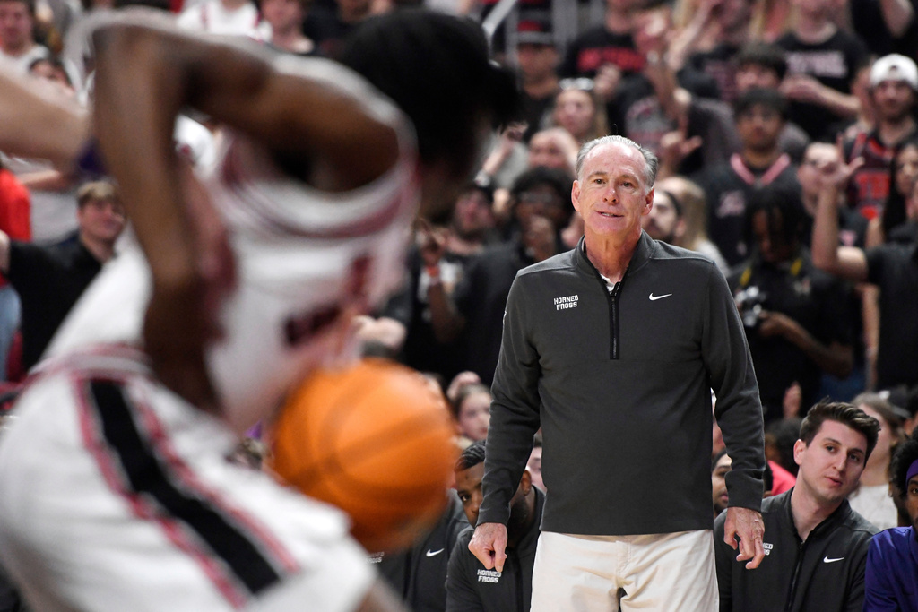 TCU head coach Jamie Dixon looks on to the court as Texas Tech rebounds the ball during the first half in an NCAA college basketball game, Tuesday, March 3, 2026, in Lubbock, Texas. (AP Photo/Annie Rice)