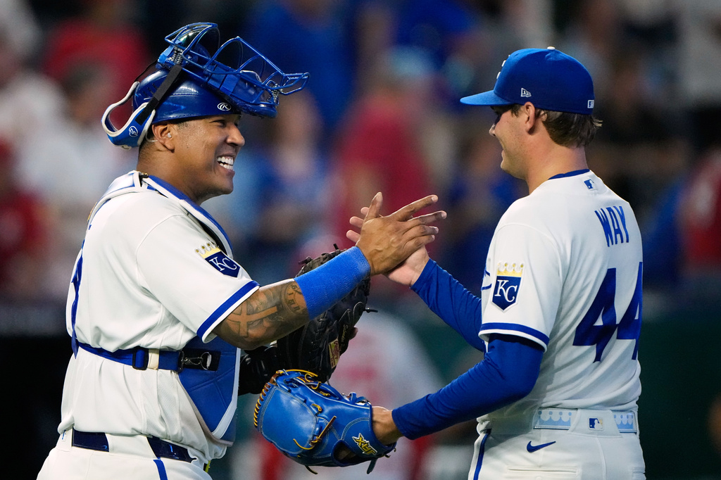 Kansas City Royals catcher Salvador Perez, left, and pitcher Beck Way (44) celebrate after their baseball game against the St. Louis Cardinals, Thursday, June 18, 2026, in Kansas City, Mo. (AP Photo/Charlie Riedel)