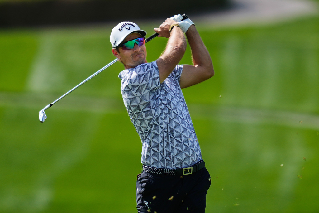 FILE - Andrea Pavan, of Italy, plays his second shot on the first hole during the third round of the Dubai Desert Classic in United Arab Emirates, Saturday, Jan. 24, 2026. (AP Photo/Altaf Qadri, File)