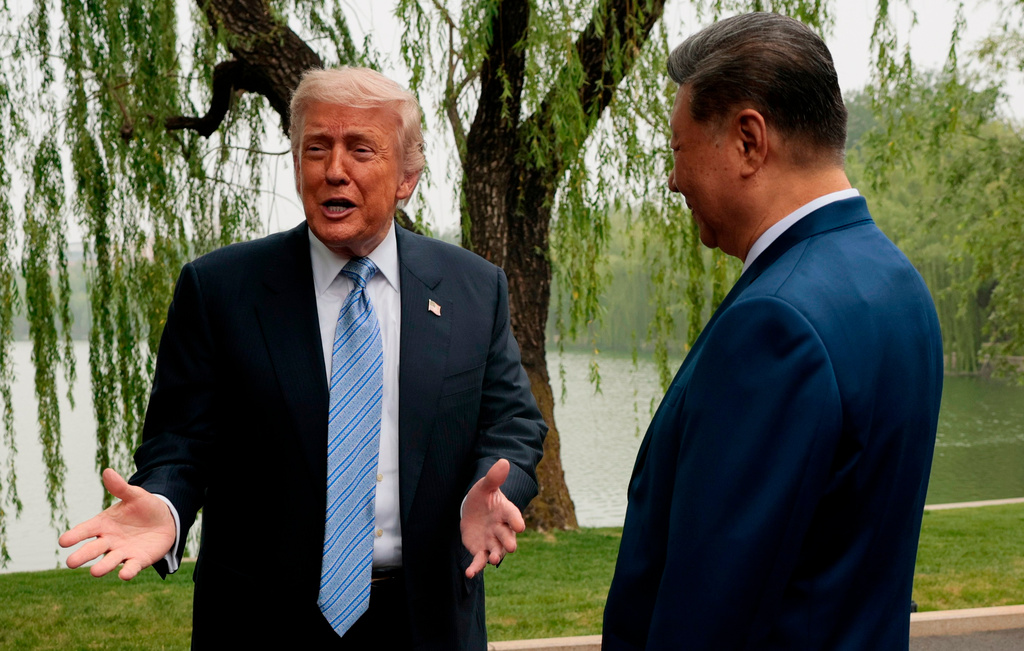 FILE - President Donald Trump, left, speaks as he is greeted by Chinese President Xi Jinping at Zhongnanhai Garden in Beijing, China, May 15, 2026. (Evan Vucci/Pool Photo via AP)