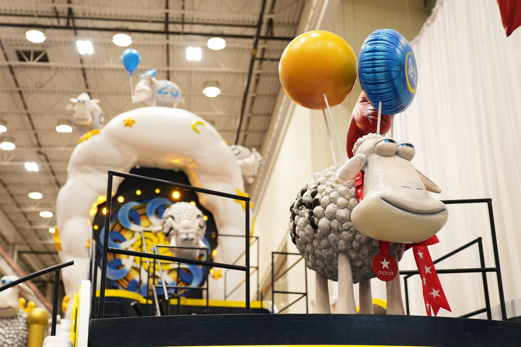 Sheep adorn a float by Serta during a press preview of the new floats at Macy's Parade Studio in Moonachie, N.J., Tuesday, Nov. 18, 2025. (AP Photo/Seth Wenig)