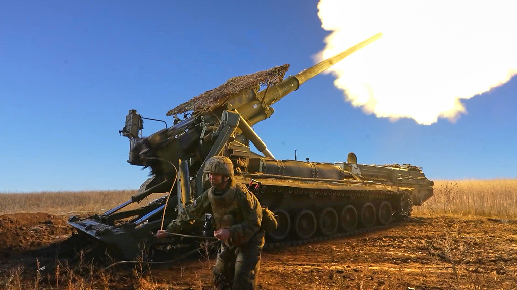 In this image, made from video and provided by Russian Defense Ministry Press Service on Thursday, Nov. 6, 2025, a Russian soldier fires a Malka self-propelled gun towards Ukrainian positions on an undisclosed location in Ukraine. (Russian Defense Ministry Press Service via AP)