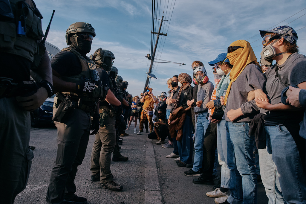 Protesters confront ICE agents outside the Delaney Hall detention center while demonstrating near the entrance gates, Wednesday, May 27, 2026, in Newark, N.J. (AP Photo/Andres Kudacki)