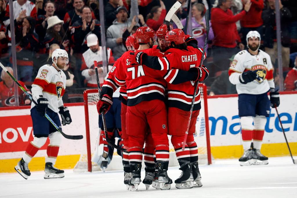 Carolina Hurricanes celebrate after a goal by Nikolaj Ehlers during the first period of an NHL hockey game against the Florida Panthers in Raleigh, N.C., Friday, Jan. 16, 2026. (AP Photo/Karl DeBlaker)
