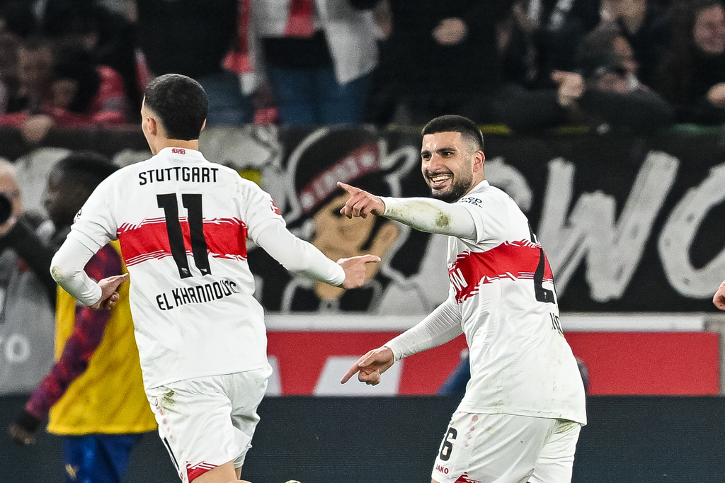 Stuttgart's Deniz Undav, right, celebrates with teammate Bilal El Khannouss after scoring during the Bundesliga soccer match between VfB Stuttgart and RB Leipzig in Stuttgart, Germany, Sunday March 15, 2026. (Harry Langer/dpa via AP)