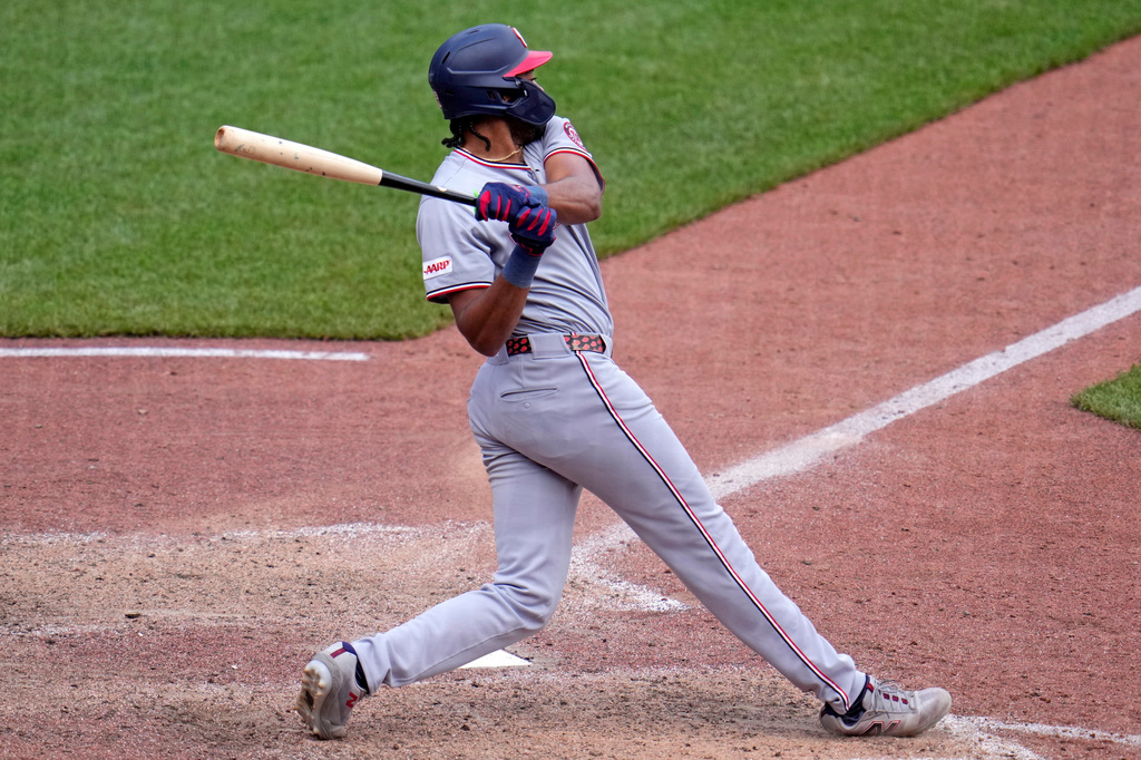 Washington Nationals' James Wood singles off Pittsburgh Pirates pitcher Dennis Santana, driving in a run, during the 10th inning of a baseball game in Pittsburgh, Thursday, April 16, 2026. (AP Photo/Gene J. Puskar)