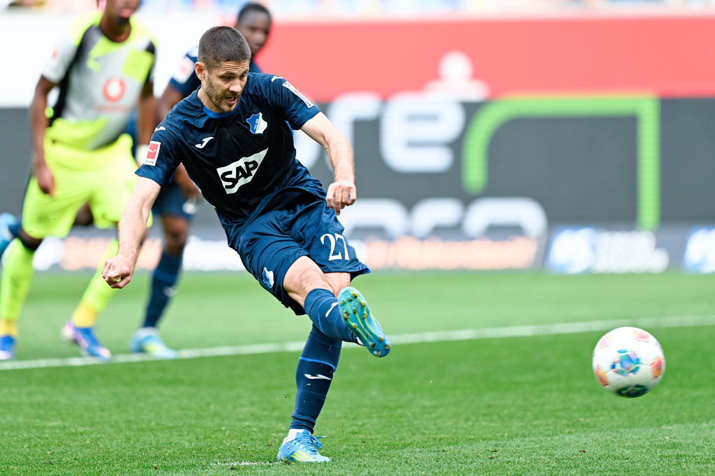 Hoffenheim's Andrej Kramaric scores a penalty during their German Bundesliga soccer match against Borussia Dortmund in Sinsheim, Germany, Saturday, April 18, 2026. (Uwe Anspach/dpa via AP)