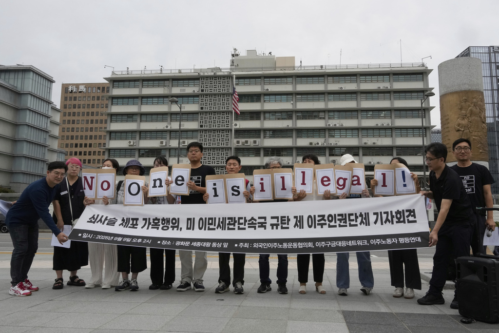 Protesters hold a sign that reads, "Condemning U.S. immigration enforcement." near the U.S. Embassy in Seoul, South Korea on Tuesday, Sept. 9, 2025 as they stage a rally against the detention of South Korean workers during an immigration raid in Georgia. (AP Photo/Ahn Young-joon)