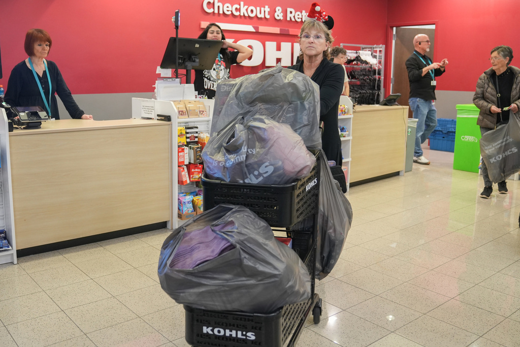 FILE - A shopper loads a cart full at Kohl's department store for Black Friday deals, Friday, Nov. 28, 2025, in Woodstock, Ga. (AP Photo/Megan Varner, File)