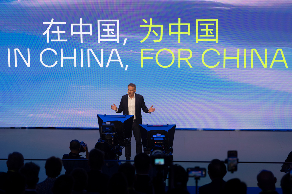 Olive Blume, Chairman of the Board of Management of Volkswagen Group, speaks near the slogan "In China, For China" during the Volkswagen Group media night ahead of the Auto Show in Shanghai, April 22, 2025. (AP Photo/Ng Han Guan)