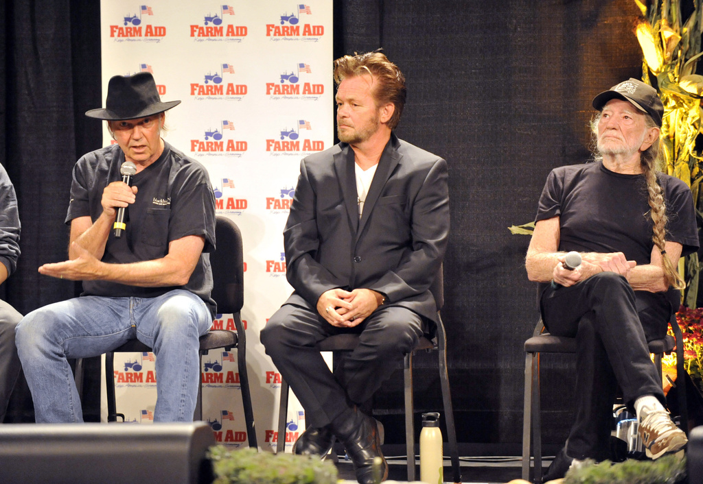 FILE - Neil Young, left, John Mellencamp, center, and Willie Nelson, right, give a news conference prior to the start of the Farm Aid 2013 concert at Saratoga Performing Arts Center in Saratoga Springs, N.Y., Sept. 21, 2013. (AP Photo/Hans Pennink, file)