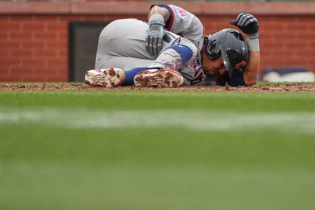 Cleveland Guardians' José Ramírez rubs the back of his leg after being hit by a foul ball during the sixth inning of a baseball game against the St. Louis Cardinals Wednesday, April 15, 2026, in St. Louis. (AP Photo/Jeff Roberson)