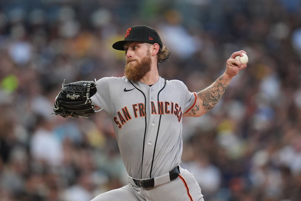 San Francisco Giants starting pitcher Carson Whisenhunt works against a San Diego Padres batter during the second inning of a baseball game Friday, July 31, 2026, in San Diego. (AP Photo/Gregory Bull)