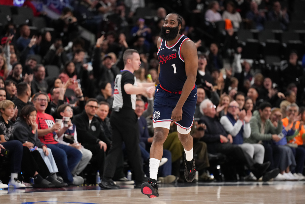 Los Angeles Clippers guard James Harden (1) celebrates his three-point basket during the second half of an NBA basketball game against the Charlotte Hornets Monday, Jan. 12, 2026, in Inglewood, Calif. (AP Photo/Jae C. Hong)