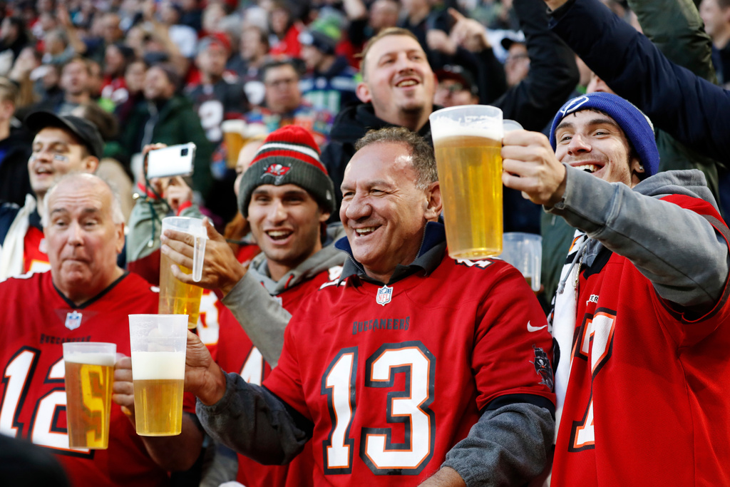 FILE - Fans cheer during an NFL football game between the Tampa Bay Buccaneers and the Seattle Seahawks at Allianz Arena in Munich, Germany, Nov. 13, 2022. (AP Photo/Steve Luciano, File)