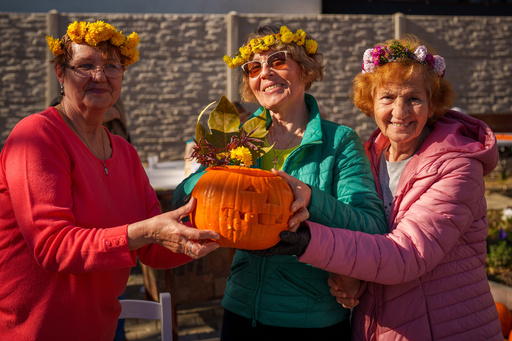Women pose with a Halloween pumpkin they carved during an event at the Salcetului day care for the elderly state facility in Bucharest, Romania, Friday, Oct. 31, 2025. (AP Photo/Vadim Ghirda) Women pose with a Halloween pumpkin they carved during an event at the Salcetului day care for the elderly state facility in Bucharest, Romania, Friday, Oct. 31, 2025. (AP Photo/Vadim Ghirda)