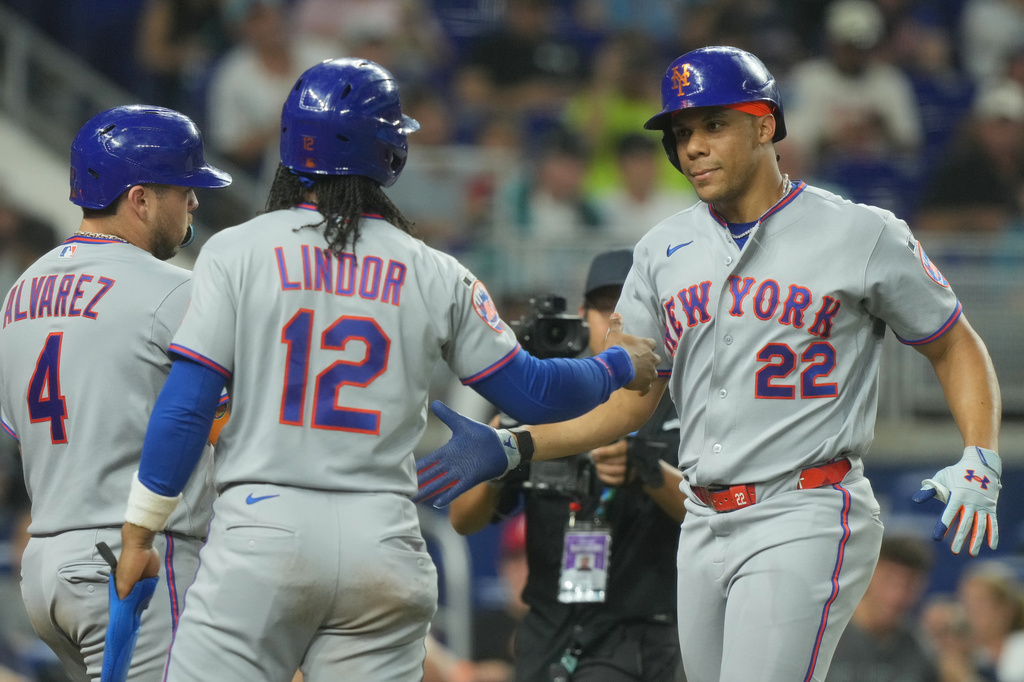 New York Mets' Juan Soto (22) celebrates his three-run home run with Francisco Lindor (12) and Francisco Alvarez (4) during the second inning of a baseball game against the Miami Marlins Tuesday, Sept. 8, 2026, in Miami. (AP Photo/Marta Lavandier)