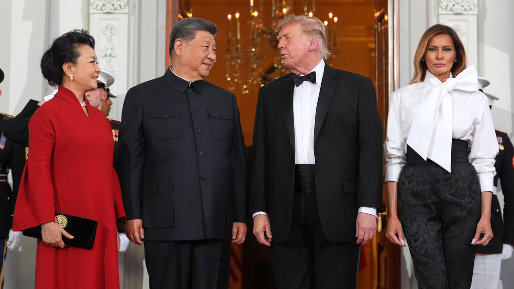President Donald Trump and first lady Melania Trump greet China's President Xi Jinping and his wife Peng Liyuan as they arrive at the North Portico of the White House for a State Dinner, Thursday, Sept. 24, 2026, in Washington. (AP Photo/Alex Brandon)