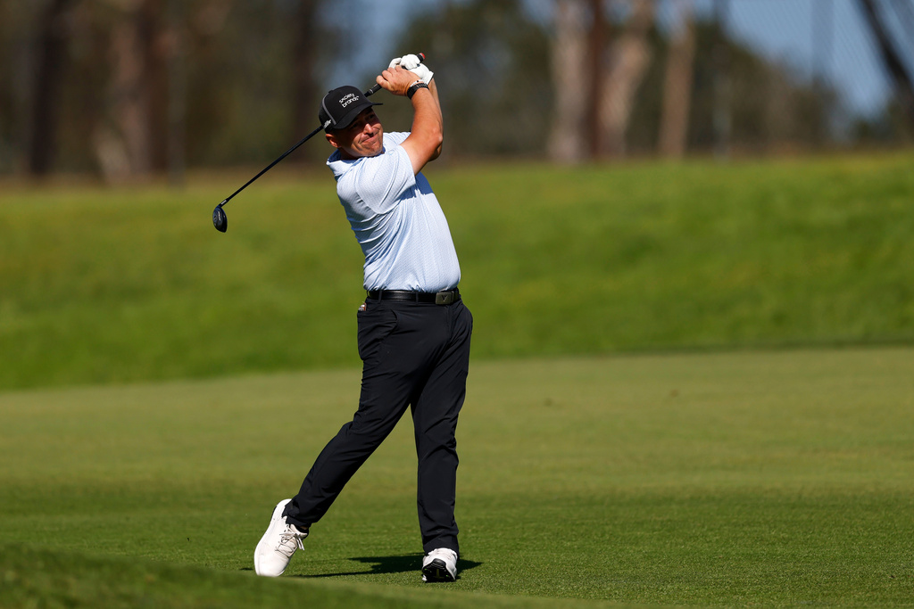 Justin Lower hits from the fairway on the ninth hole on the North Course at Torrey Pines during the first round of the Farmers Insurance Open golf tournament Thursday, Jan. 29, 2026, in San Diego. (AP Photo/Caroline Brehman)