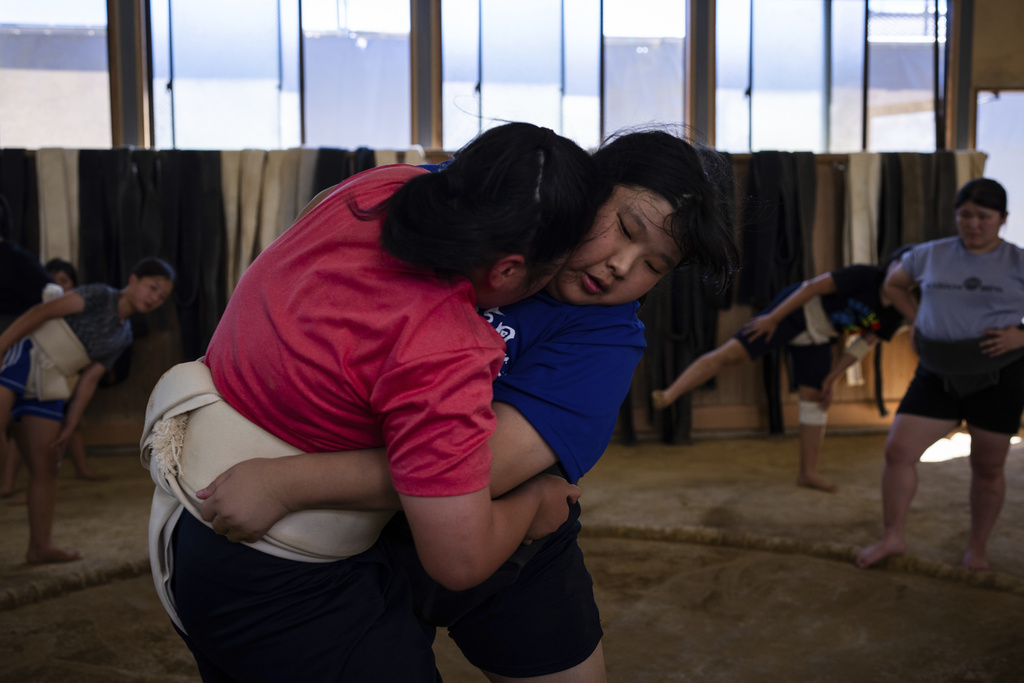 Wrestlers train during a practice session at a sumo camp in Tottori Johoku High School in Tottori, Japan, on July 28, 2025. (AP Photo/Louise Delmotte)