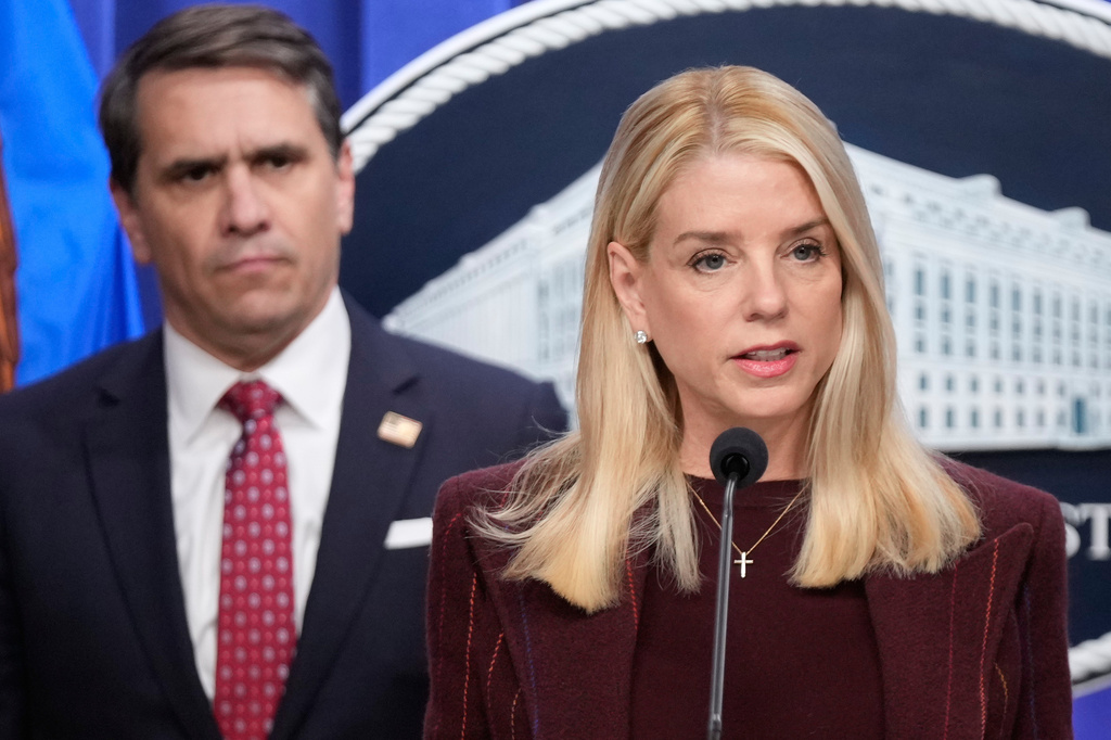 FILE - Attorney General Pam Bondi speaks with reporters during a news conference at the Department of Justice, Nov. 19, 2025, in Washington, as Deputy Attorney General Todd Blanche, listens. (AP Photo/Mark Schiefelbein, file)