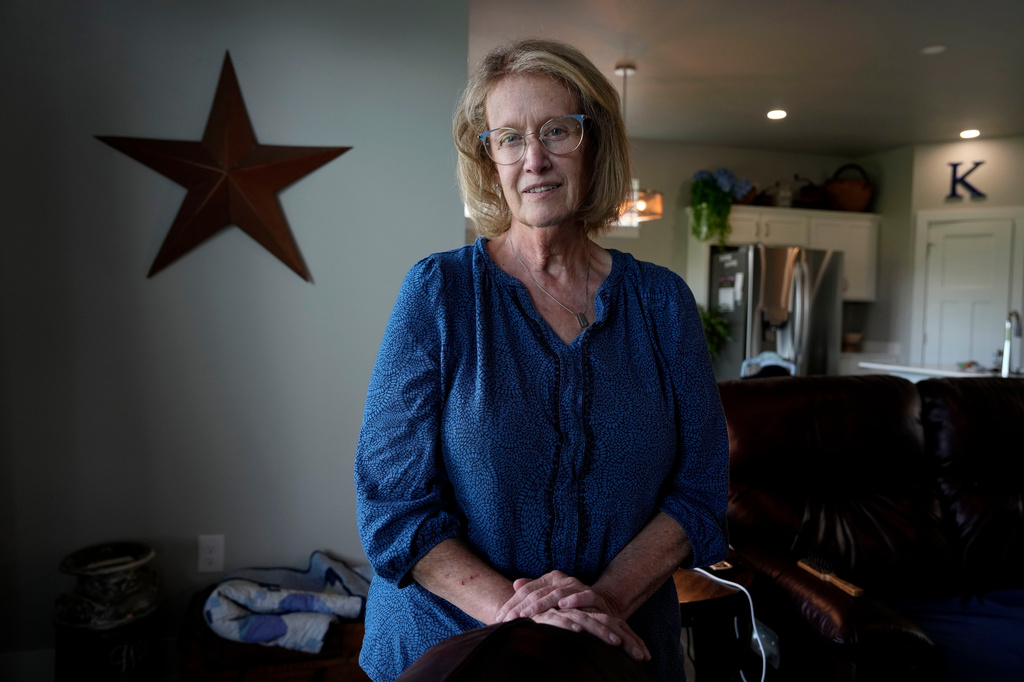 Jill Kordick poses in her home, June 7, 2026, in Norwalk, Iowa. (AP Photo/Charlie Neibergall)