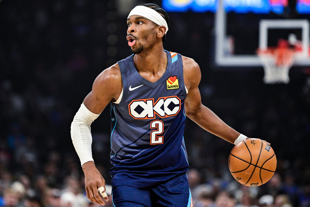 Oklahoma City Thunder guard Shai Gilgeous-Alexander drives the ball against the Indiana Pacers during the first half of an NBA basketball game Friday, Jan. 23, 2026, in Oklahoma City. (AP Photo/Gerald Leong)