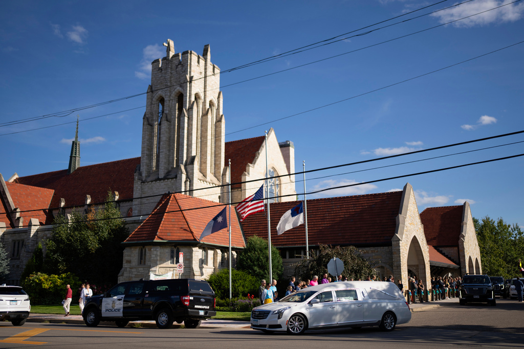 The motorcade departs after the funeral for 8-year-old Fletcher Merkel, who was killed in a church school shooting, at Mt. Olivet Lutheran Church, Sunday, Sept. 7, 2025, in Minneapolis. (Jeff Wheeler/Star Tribune via AP)