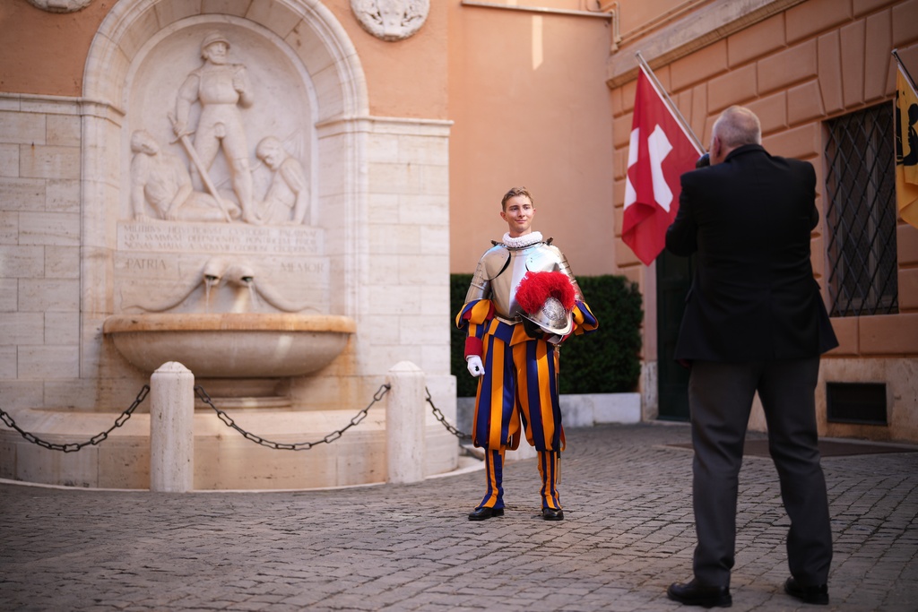 A Pontifical Swiss Guards has a photo taken ahead of his swearing in ceremony, at the Vatican, Saturday, Oct. 4, 2025. (AP Photo/Andrew Medichini)