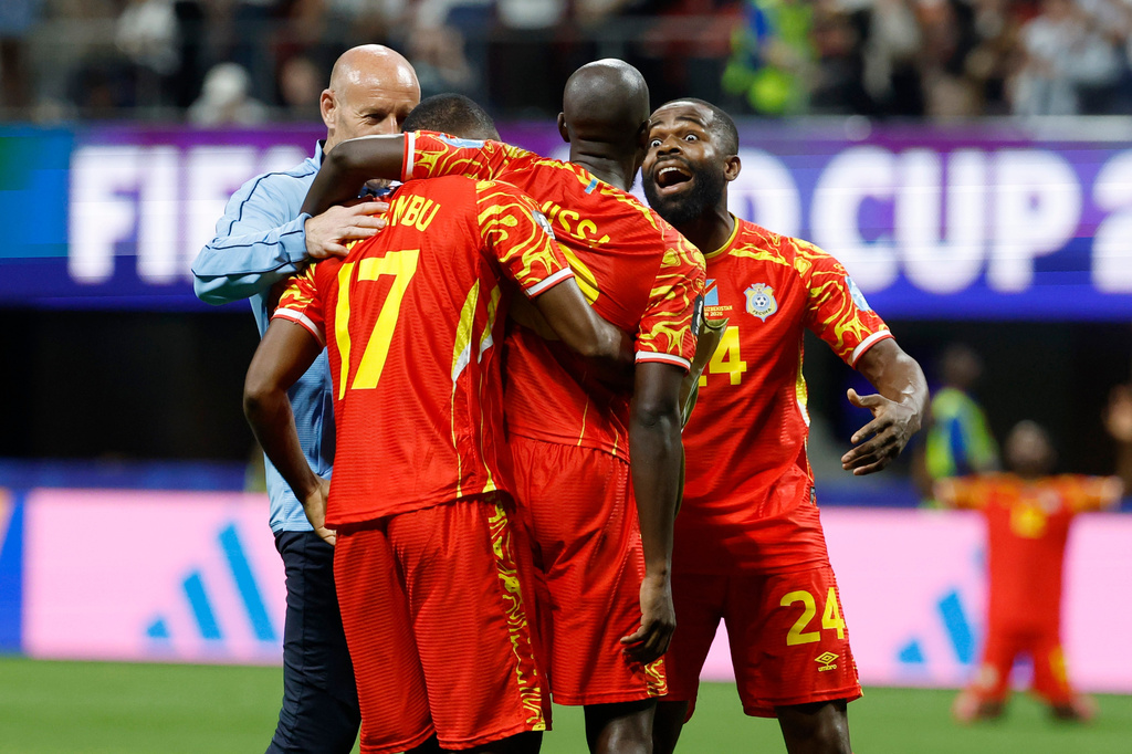 Congo's Cedric Bakambu (17), Yoane Wissa (20) and Gedeon Kalulu (24) celebrate a win during the World Cup Group K soccer match between DR Congo and Uzbekistan in Atlanta, Saturday, June 27, 2026. (AP Photo/Erik S. Lesser)