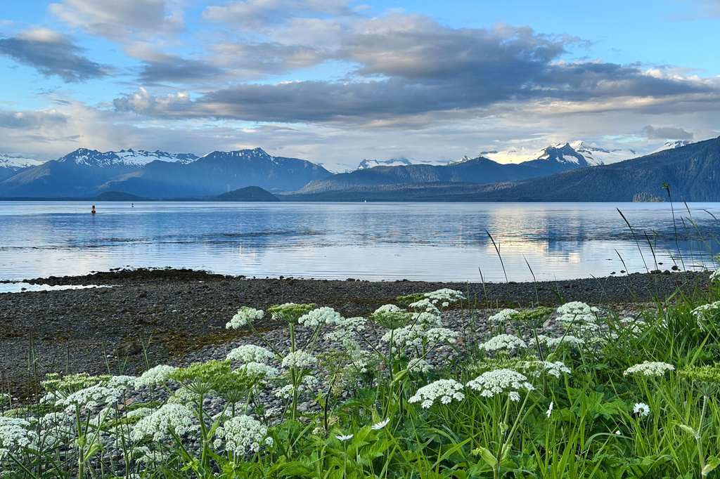 The sun shines on mountains across Frederick Sound from Petersburg, Alaska, Thursday, July 2, 2026, in Petersburg. (AP Photo/Becky Bohrer)