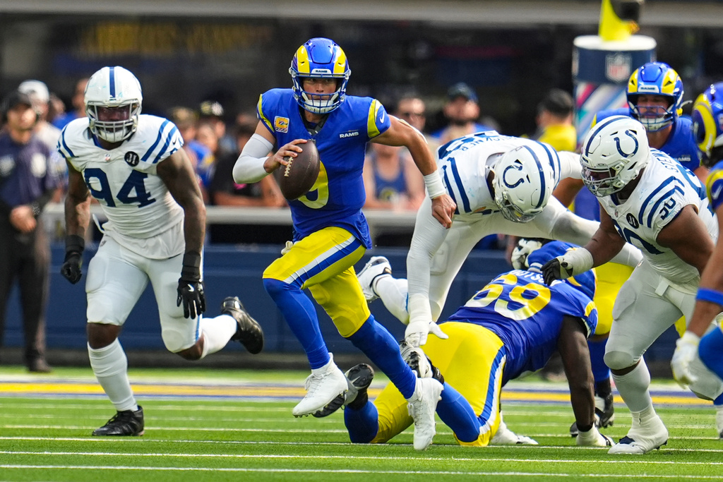 Los Angeles Rams quarterback Matthew Stafford (9) scrambles against the Indianapolis Colts during the second hall of an NFL football game Sunday, Sept. 28, 2025, in Inglewood, Calif. (AP Photo/Marcio Jose Sanchez)