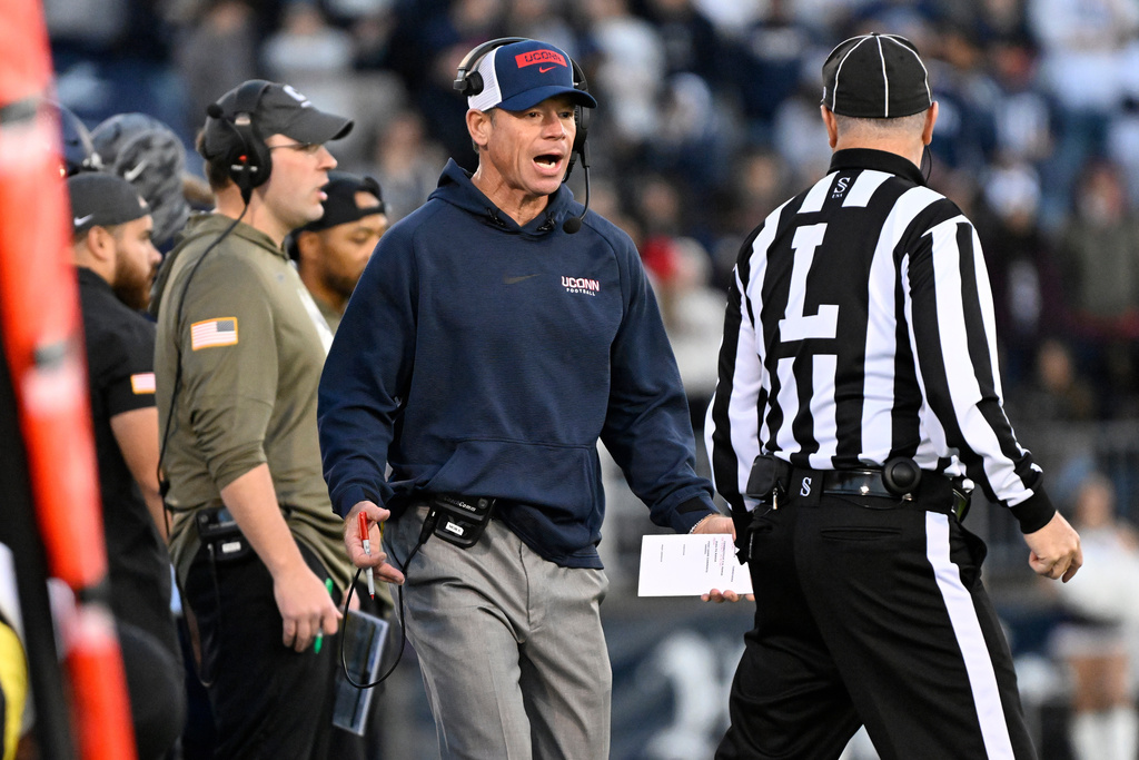 UConn head coach Jim Mora talks with an official during the first half of an NCAA college football game against Duke, Saturday, Nov. 8, 2025, in East Hartford, Conn. (AP Photo/Jessica Hill)