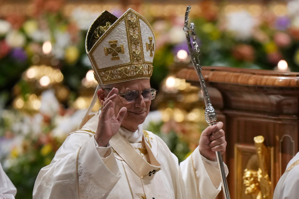 Pope Leo XIV waves after leading the Easter Vigil inside St. Peter's Basilica at The Vatican, Saturday, April 4, 2026. (AP Photo/Andrew Medichini)