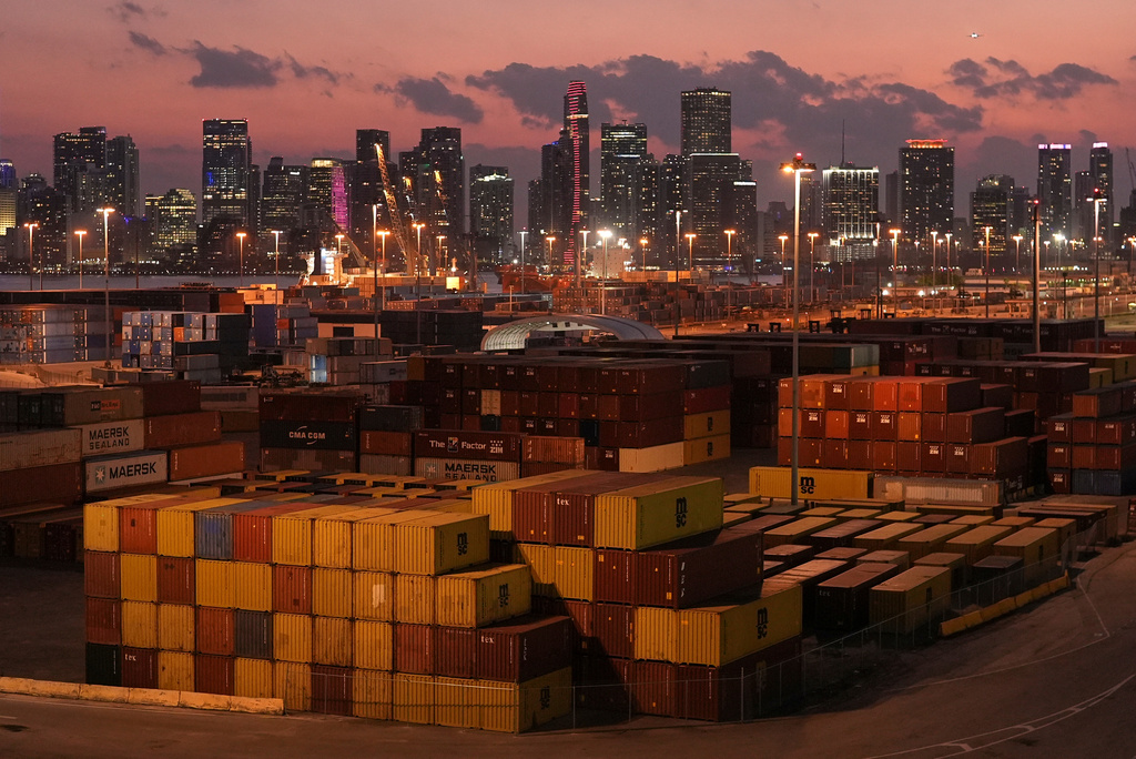 FILE - Shipping containers sit stacked at PortMiami, in front of the downtown Miami skyline, at sunset on April 16, 2025. (AP Photo/Rebecca Blackwell, File)