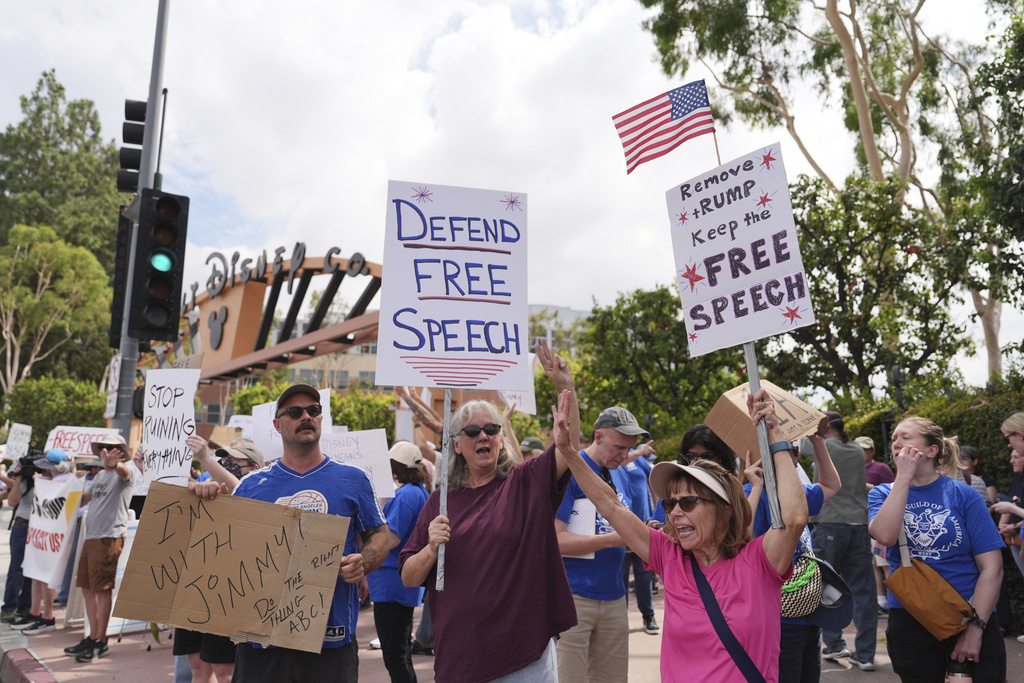 Demonstrators picket in response to the suspension of Jimmy Kimmel's late-night show outside of Walt Disney Studios in Burbank, Calif., on Thursday, Sept. 18, 2025. (AP Photo/Jae C. Hong)