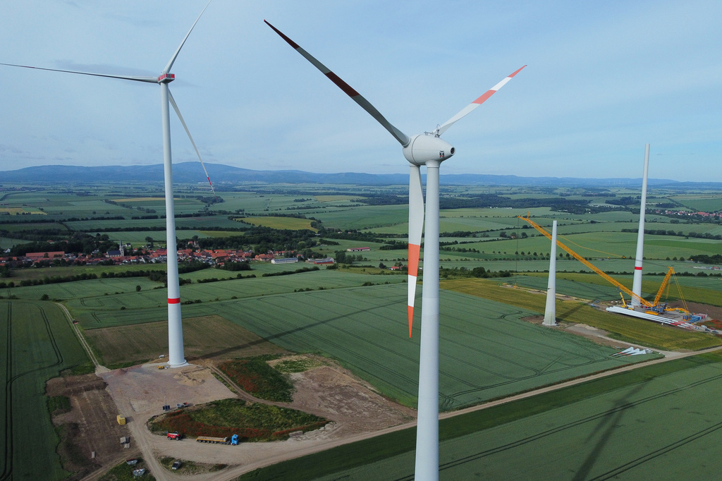 FILE - Wind turbines stand in various stages of completion near Deersheim, Germany, June 10, 2026. (AP Photo/Matthias Schrader, File)