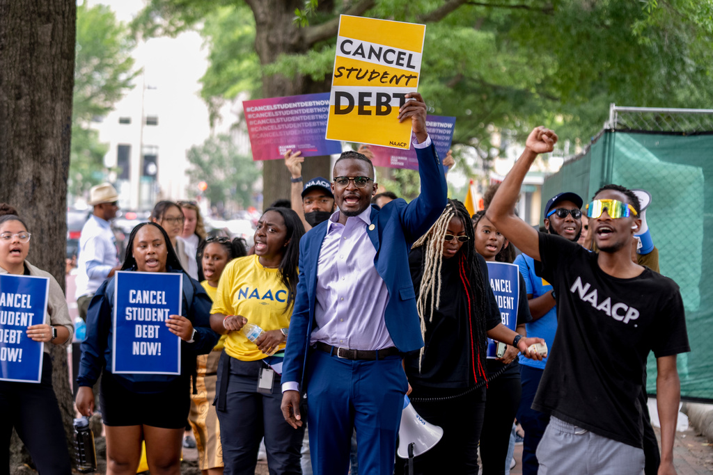 FILE - People demonstrate in Lafayette Park across from the White House in Washington, June 30, 2023, after a sharply divided Supreme Court has ruled that the Biden administration overstepped its authority in trying to cancel or reduce student loan debts for millions of Americans. (AP Photo/Andrew Harnik, File)