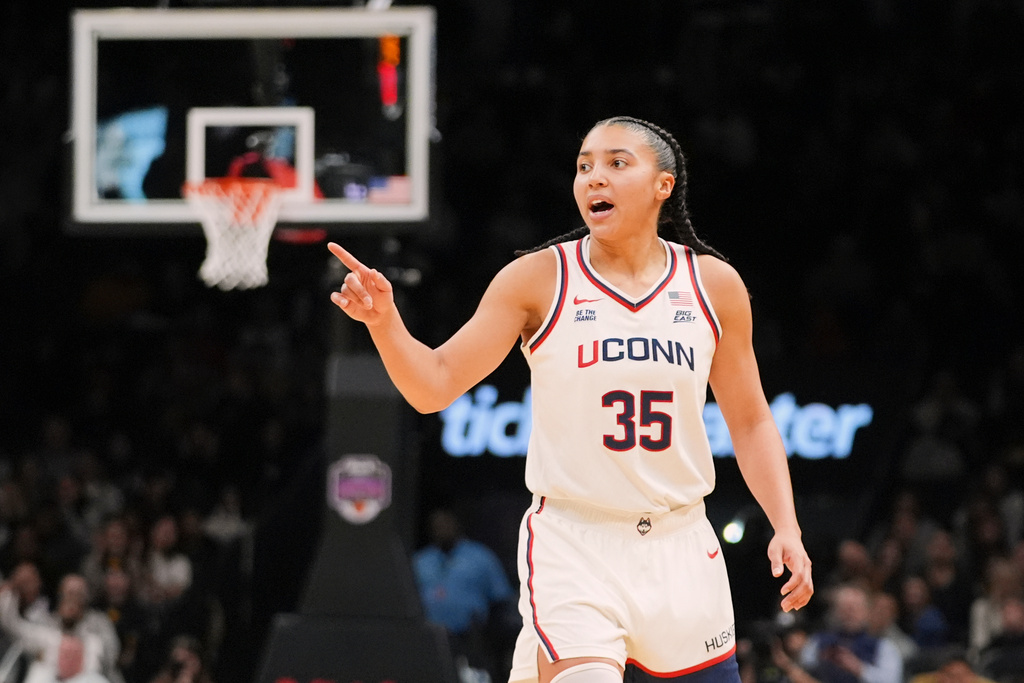 FILE - UConn's Azzi Fudd (35) gestures to teammates after making a three-point shot during the second half of an NCAA college basketball game against the Iowa Saturday, Dec. 20, 2025, in New York. (AP Photo/Frank Franklin II, File)