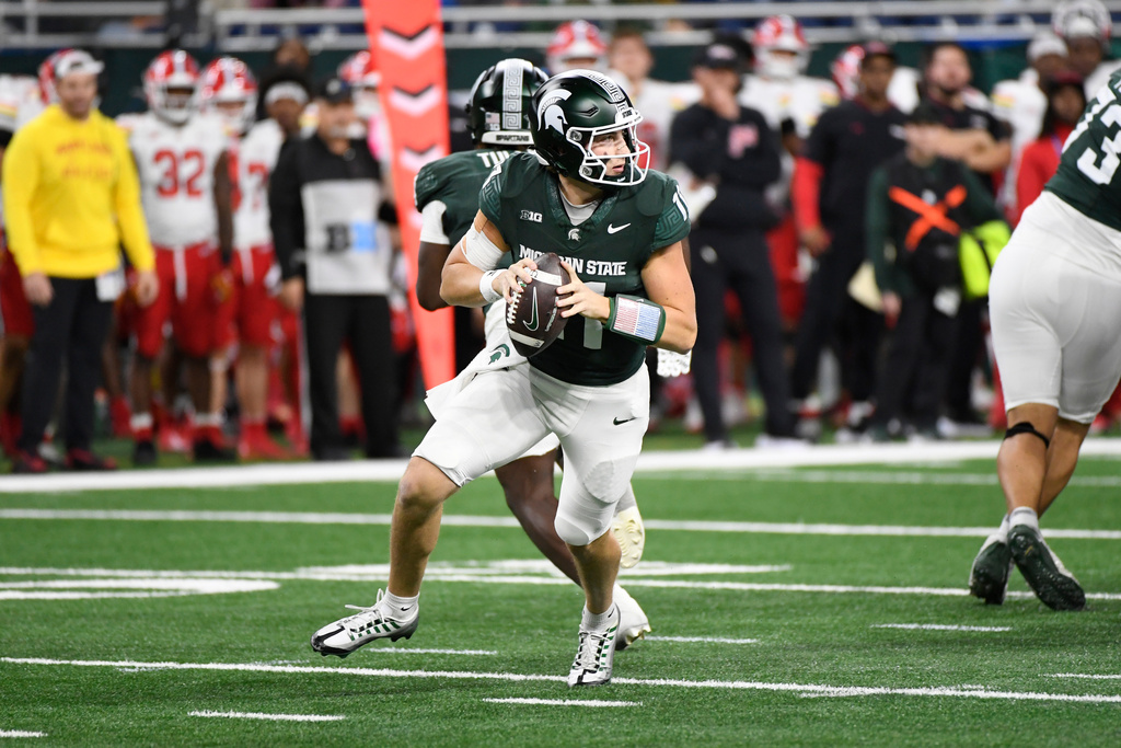 Michigan State quarterback Alessio Milivojevic looks to pass during the first half of an NCAA college football game against Maryland, Saturday, Nov. 29, 2025, in Detroit. (AP Photo/Jose Juarez)